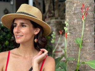 Girl with rainbow origami earrings