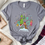 Thumbnail: Retro Grinc Village Graphic Tee