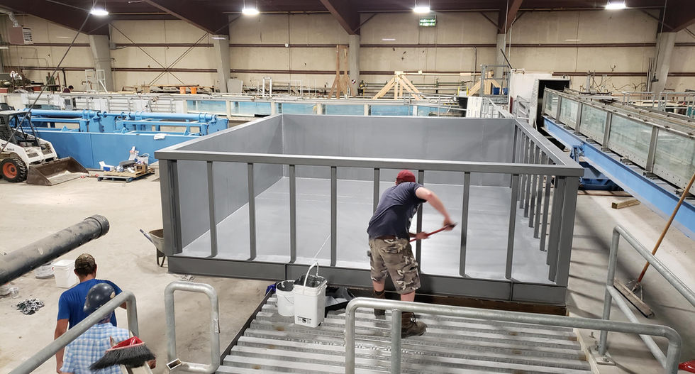 Large steel tank in a research and development warehouse.