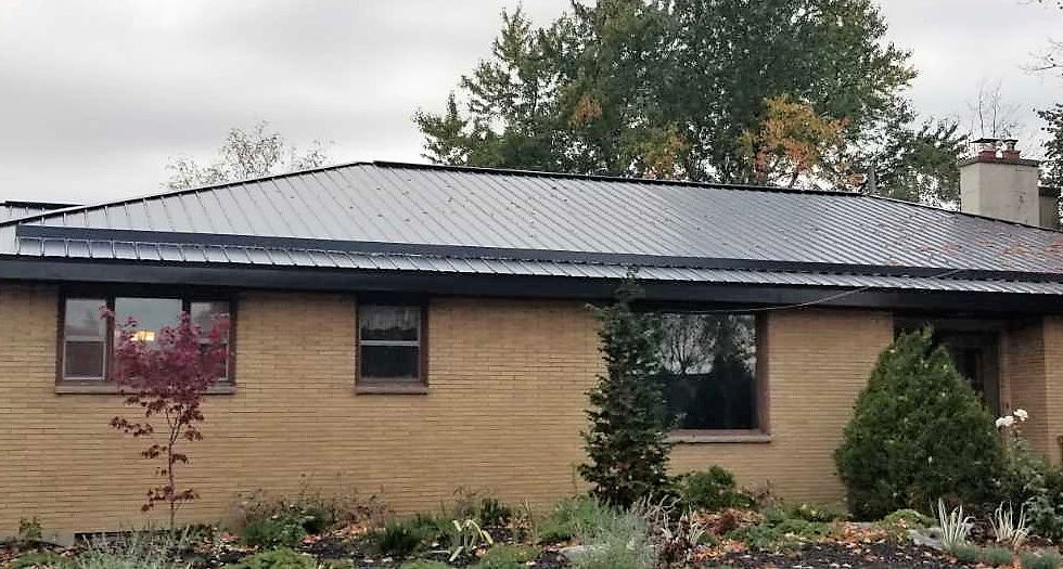 Installation of new steel roof, including new soffit, fascia, and snowguard to match