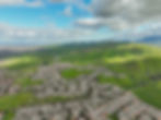 homes and green hills