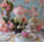 Vintage tea party - tea cups, teapots and gold cutlery flatware with vintage silver trophy