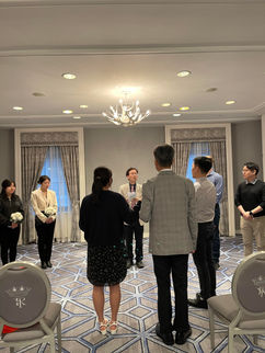 Small venue wedding rehearsal from middle of aisle view.