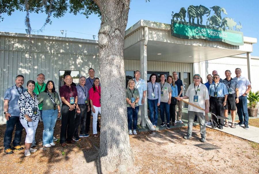 Cast Members near Disney's Animal Kingdom Cast Services unearthing time capsule with Walt Disney World President Jeff Vahle