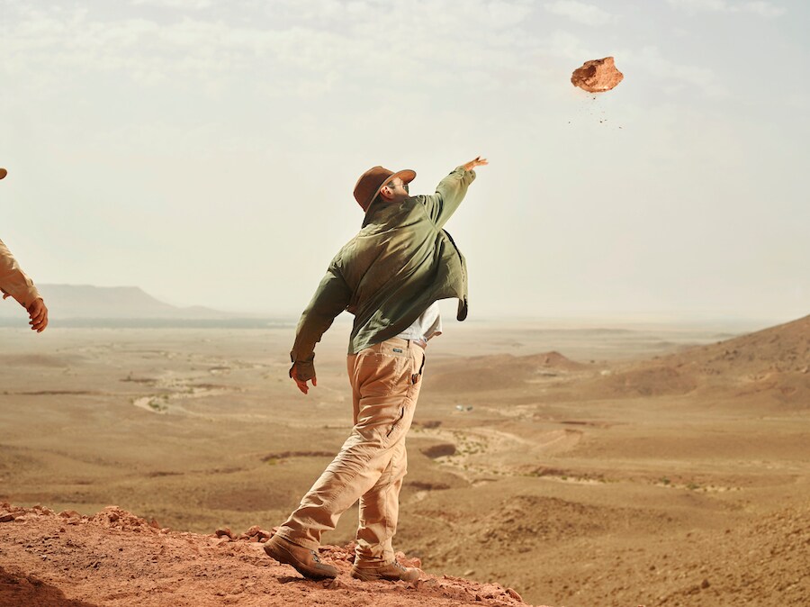 Nizar Ibrahim removing rocks from dig site – Credit: Paolo Verzone