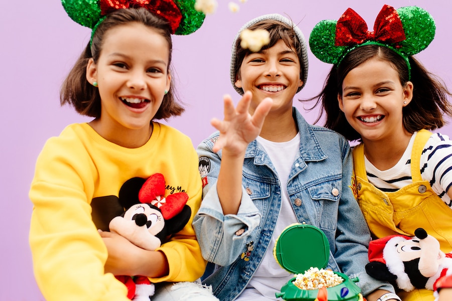 Guests in front of the Purple Wall at Magic Kingdom Park