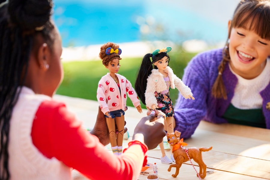 Girl playing with a Disney ily 4EVER doll