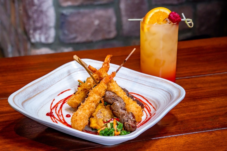 Jerk-seasoned beef tenderloin skewers and coconut shrimp with raspberry rum sauce