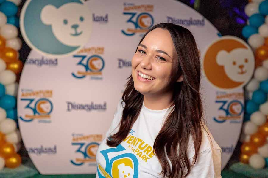 Marisa Morris in front of a themed backdrop at CHOC Adventure in the Park