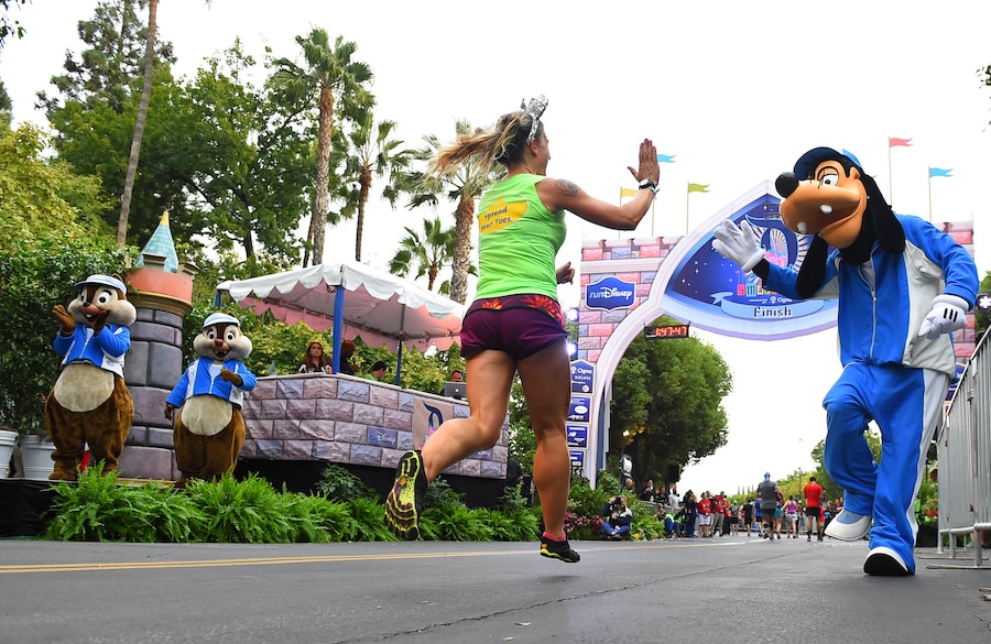runDisney participant with Disney Characters