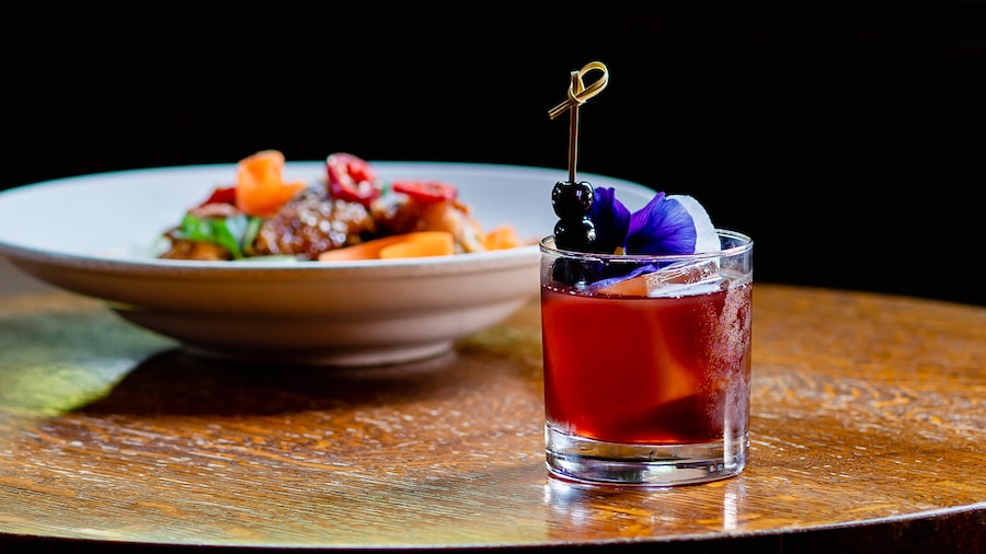 Sake and dish from Hearthstone Lounge at Disney’s Grand Californian Hotel & Spa