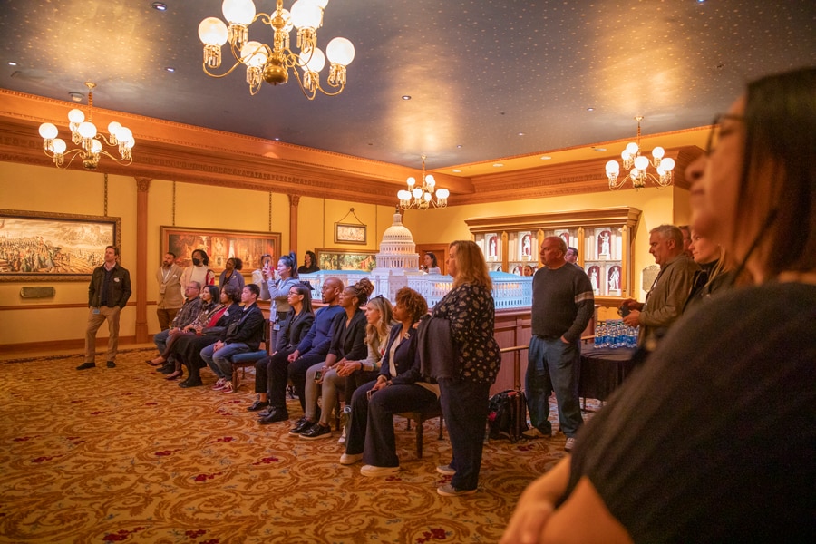 Cast watch the new feature play inside the Main Street Opera House