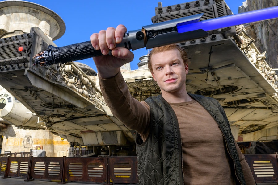 Cameron Monaghan holding the Cal Kestis legacy lightsaber hilt