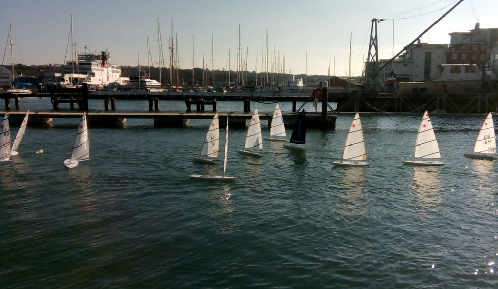 RC Lasers sailing outside the CCYC pontoons