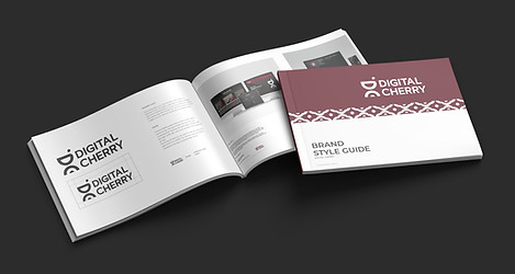Magazine mockup of the brand guidelines for Digital Cherry showing the cover and an open spread with the primary logo and website mockups with their branding applied.