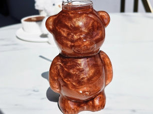 Copper edible drink glitter in a teddy bear shaped glass