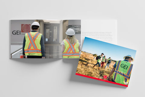 A brochure mockup for GEI Canada showing workers in safety vests and helmets both indoors at a GEI office and outdoors in a grassy field, with the text "EXPLORE" and the GEI logo featured.