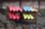 Kayaks stacked on a rack.