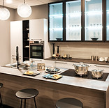 neutral-fitted-kitchen-with-island-and-bar-stools-2025-03-09-23-28-06-utc.jpg
