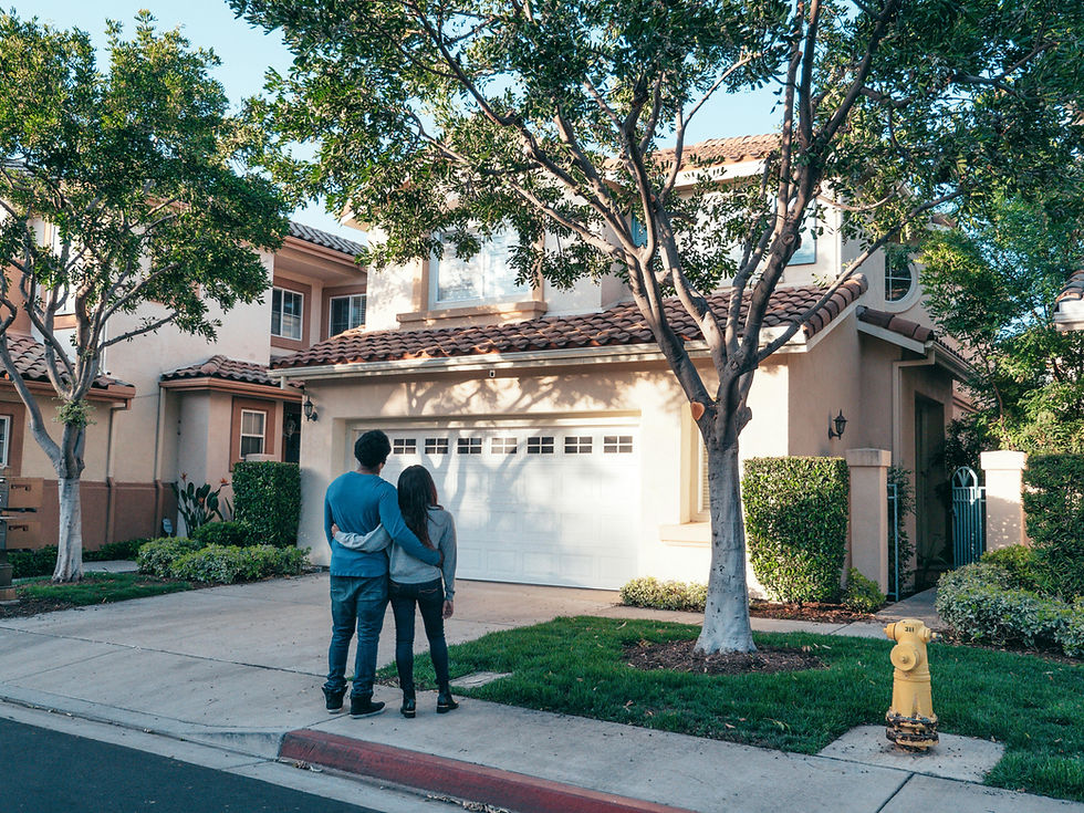 couple in front of house