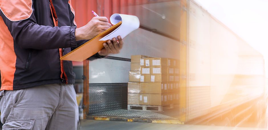 Freight industry logistics and transportation, Warehouse worker holding clipboard inspecti
