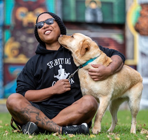 Portrait of Kadek Artayana and Livina (his guide dog)
