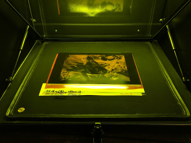 Light exposure unit with vaccum table.