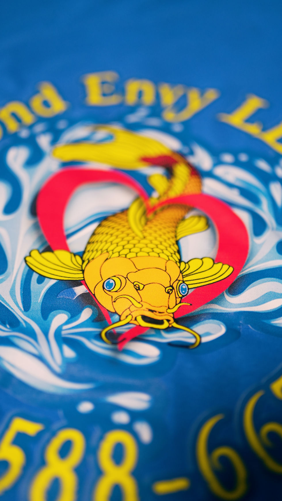 Blue shirt with a full-color fish graphic