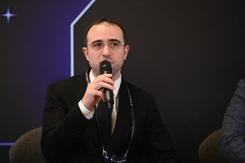 Photo documentation illustrating Loran Jacobs working as Executive Leadership at Deep-Tech Ventures during the "Panel Session on AI at IV Forum of Technology Entrepreneurship" project in Moskva. (Track: Entrepreneurship)