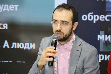 Photo documentation illustrating Loran Jacobs working as Executive Leadership at Deep-Tech Ventures during the "Open Innovations Forum" project in Skolkovo Innovation Center. (Track: Top Management)