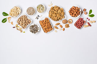 Different types of nuts in composition on white background in studio_edited_edited.jpg