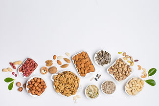 Different types of nuts in composition on white background in studio_edited.jpg
