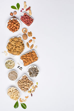 Different types of nuts in composition on white background in studio_edited.jpg
