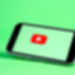 phone with a video play button on it.jpg