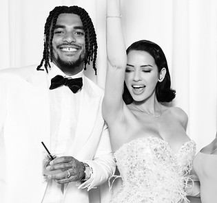 Friends posing for a black and white glam photo booth.