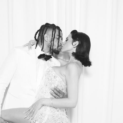 Cinematic black and white photo booth portrait for luxury wedding entertainment.