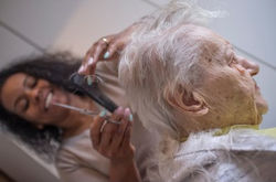 black-caregiver-girl-cuts-hair-260nw-1351347839_edited.jpg