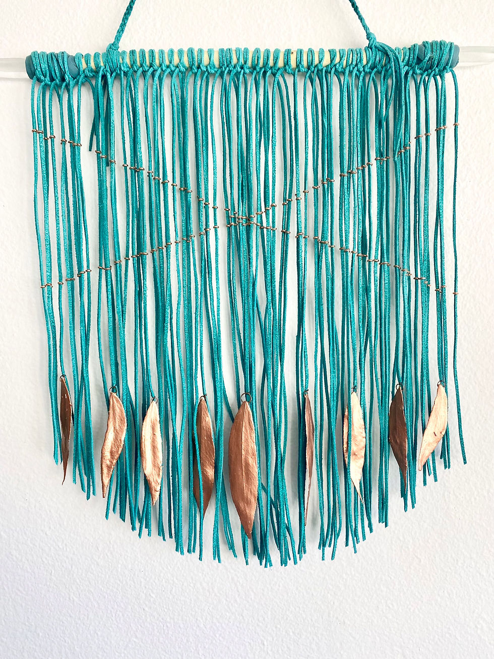 Thumbnail: Leather wall hanging with copper leafs and lemurian quartz