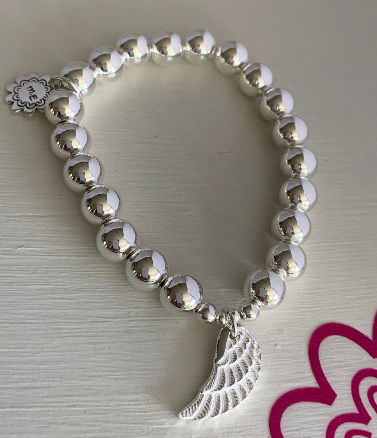8mm sterling silver ball bracelet with 'angel wing' charm