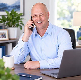 Shannon Redman providing Medicare support by phone from his office.