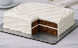 Handmade Double‑sheet date‑nut cake featuring moist layers, chopped dates, walnuts, and white fluffy frosting. Freshly baked in Ohio and perfect for small celebrations or everyday treats.