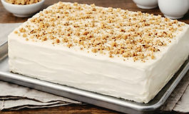 Handmade half‑sheet double‑layer cake featuring moist stacked layers and white fluffy frosting. Freshly baked in Ohio for pickup and perfect for events, parties, or casual occasions.