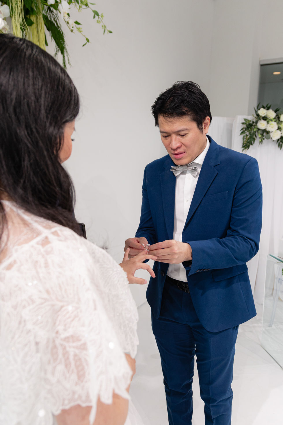 emotional-groom-wedding-ring-exchange-at-the-ensora-indoor-wedding-vancouver