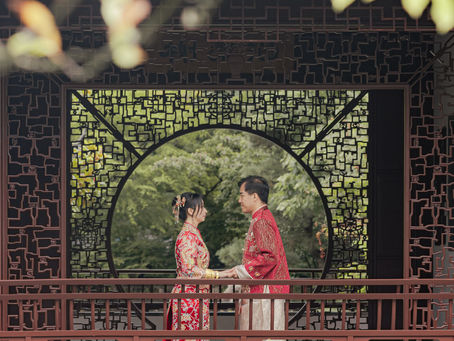 This is a couple portrait in Chinese Wedding Dress in Dr. Sun Yat-Sen Classical Chinese Garden in vancouver ,BC