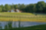 Scenic landscape view of Meadow Creek Farm property with pond built by Omnibuild Construction in Floyd VA