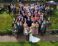 Group photo of wedding guests by drone photographer in the Midlands.