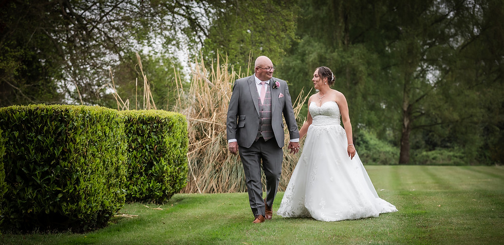 Wedding-couple-walking-together-by-Birmingham-based-wedding-photographer.jpg
