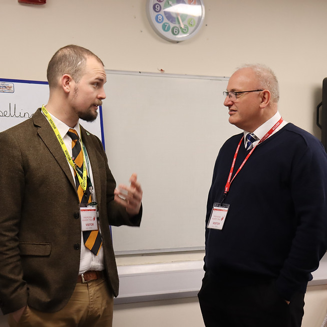 Ed with MP Ian Roome in a classroom