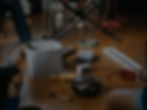 Instruments laid out on a wooden floor.