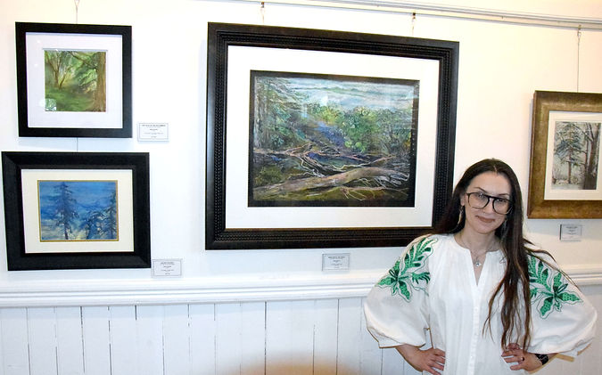 Anna Buckie's closing reception for her "Parallels: Finding Monet During War Time" was held May 17. The Gibson Gallery is now featuring the annual "Student Pix" exhibit until May 30.